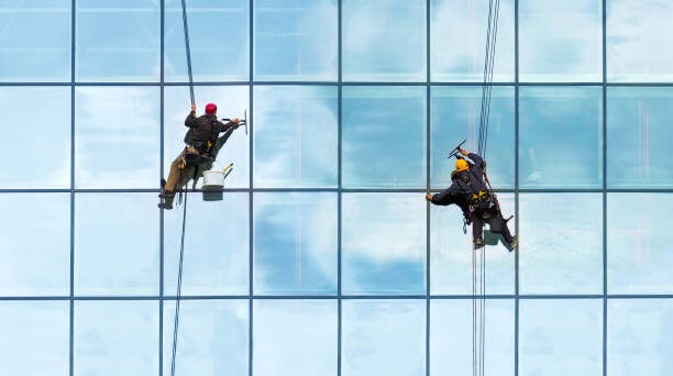 two man cleaning exterior window